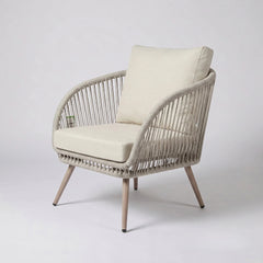 Natural polyrattan garden lounge furniture set with soft cushions for comfortable outdoor relaxation