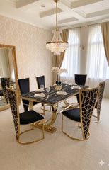 Luxury Ariana 180cm marble dining suite for Leeds renovations, featuring a polished cream tabletop, radiant gold base and distinctive Vienna dining chairs.