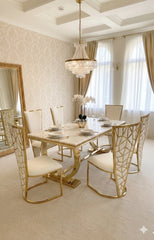 Ariana cream marble dining table with geometric gold pedestal and Vienna chairs for Birmingham dining rooms, offering refined designer styling and comfortable seating for 6–8 adults.