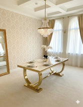 Refined Ariana 160cm and 180cm marble dining table set for Leeds interiors, featuring a glossy white tabletop, sculptural gold base and sophisticated contemporary seating.