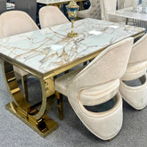 Ariana 180cm white and gold marble dining table with Santo chairs for sophisticated London dining rooms, combining high-gloss marble with a polished gold pedestal.