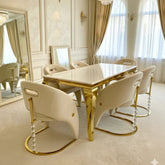 Elegant cream gold marble dining table with upholstered Vegas dining chairs creating a premium dining room interior in Surrey, Essex and Hertfordshire homes