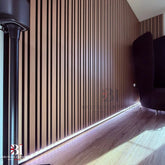 Dark oak wall panel featuring two different slat widths