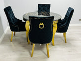 Majestic black gold lion knocker dining chairs paired with marble table creating a luxury statement interior in Oxford, Cambridge and Bath UK homes