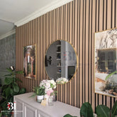 Natural oak multi-width acoustic wall panel in a living room