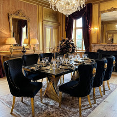 Ravello 180cm black marble dining table with polished gold geometric pedestal and Valentino seating, offering striking designer styling for contemporary interiors.