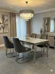 Premium dining furniture featuring a grey marble tabletop and Lasco Grey chairs for luxury Newcastle homes.