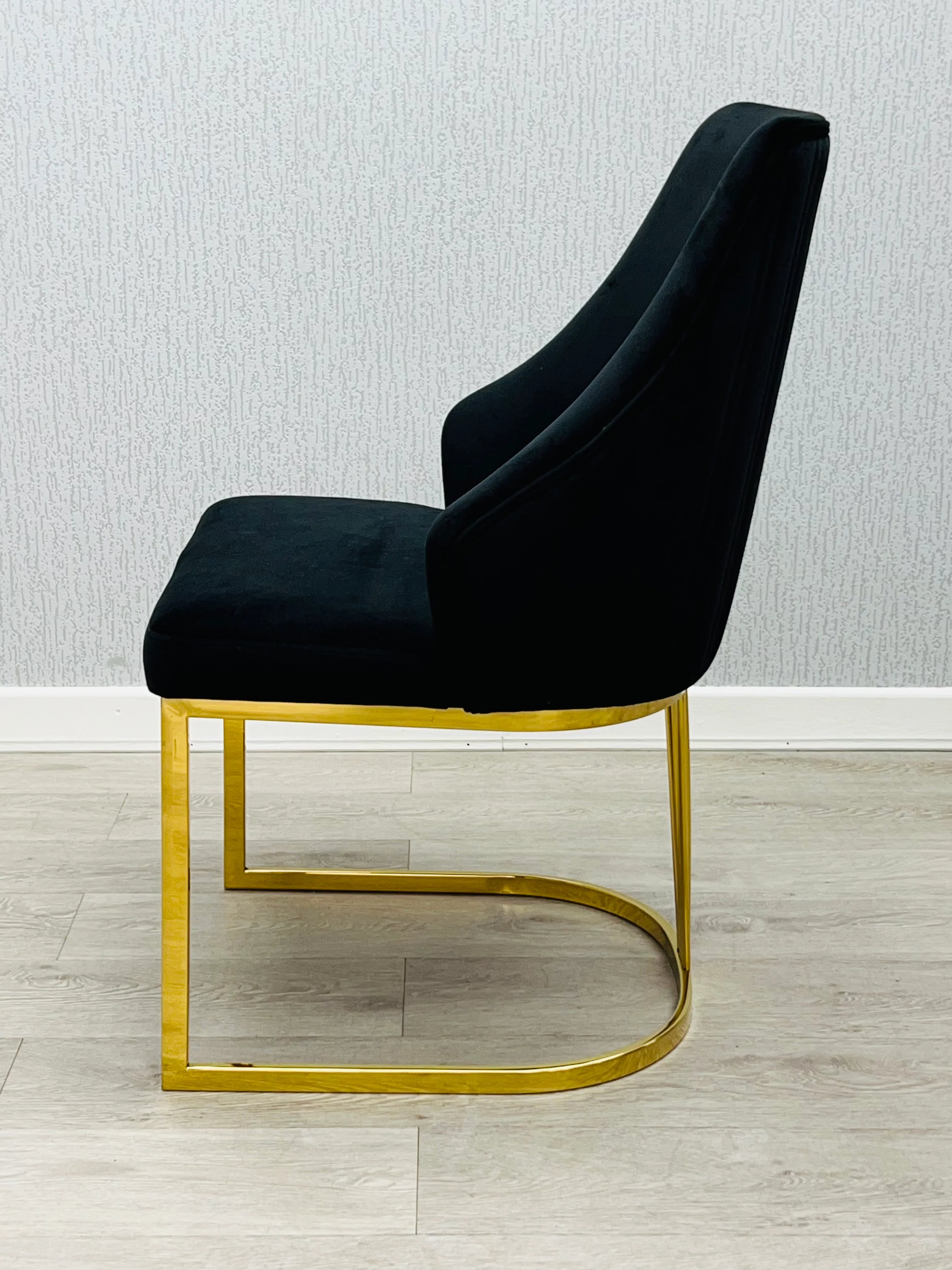 160cm and 180cm black marble dining suite with polished gold detailing and Lasco chairs, offering an elegant 6–8 seater solution for Southampton homes, family dining and entertaining guests.