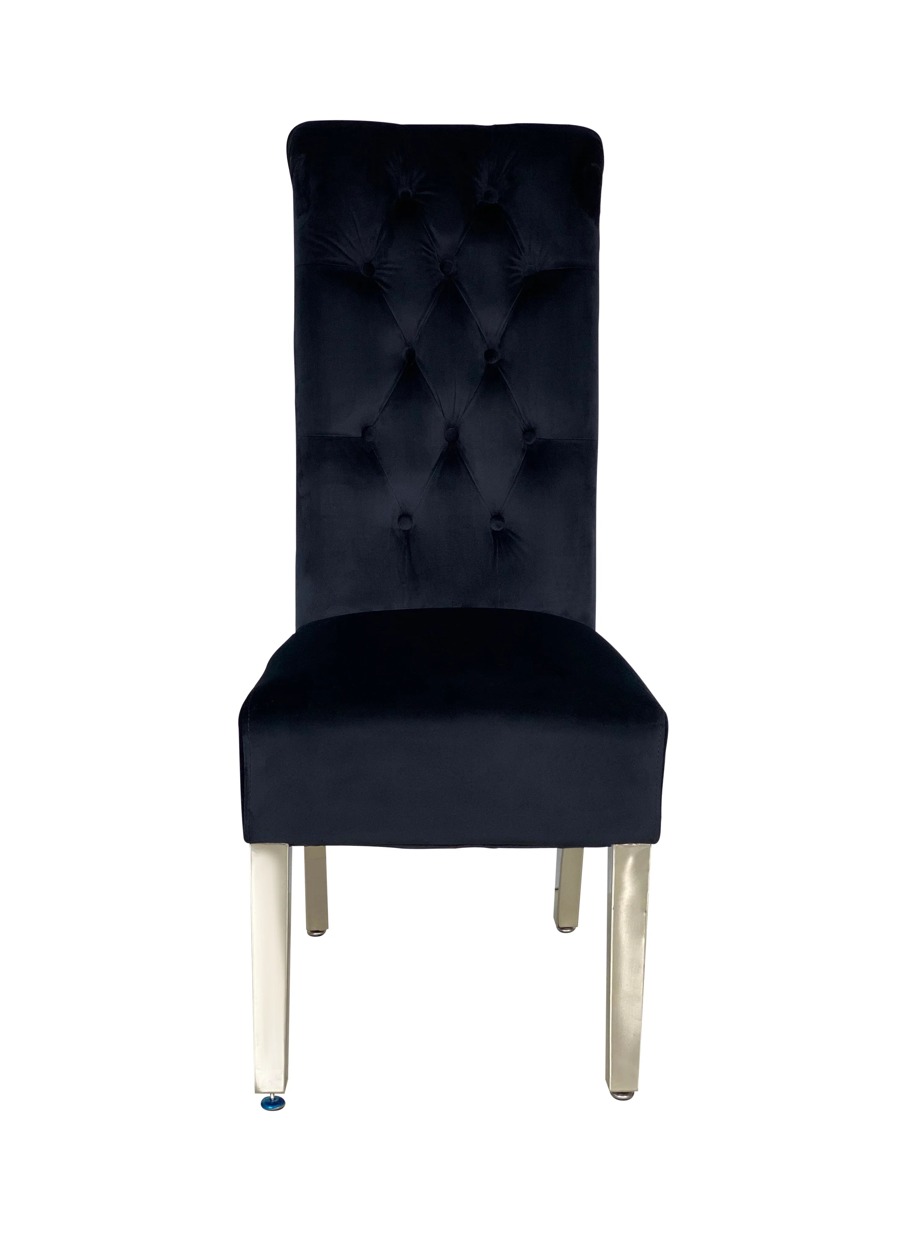 Grey marble dining table paired with comfortable upholstered black lion knocker chairs