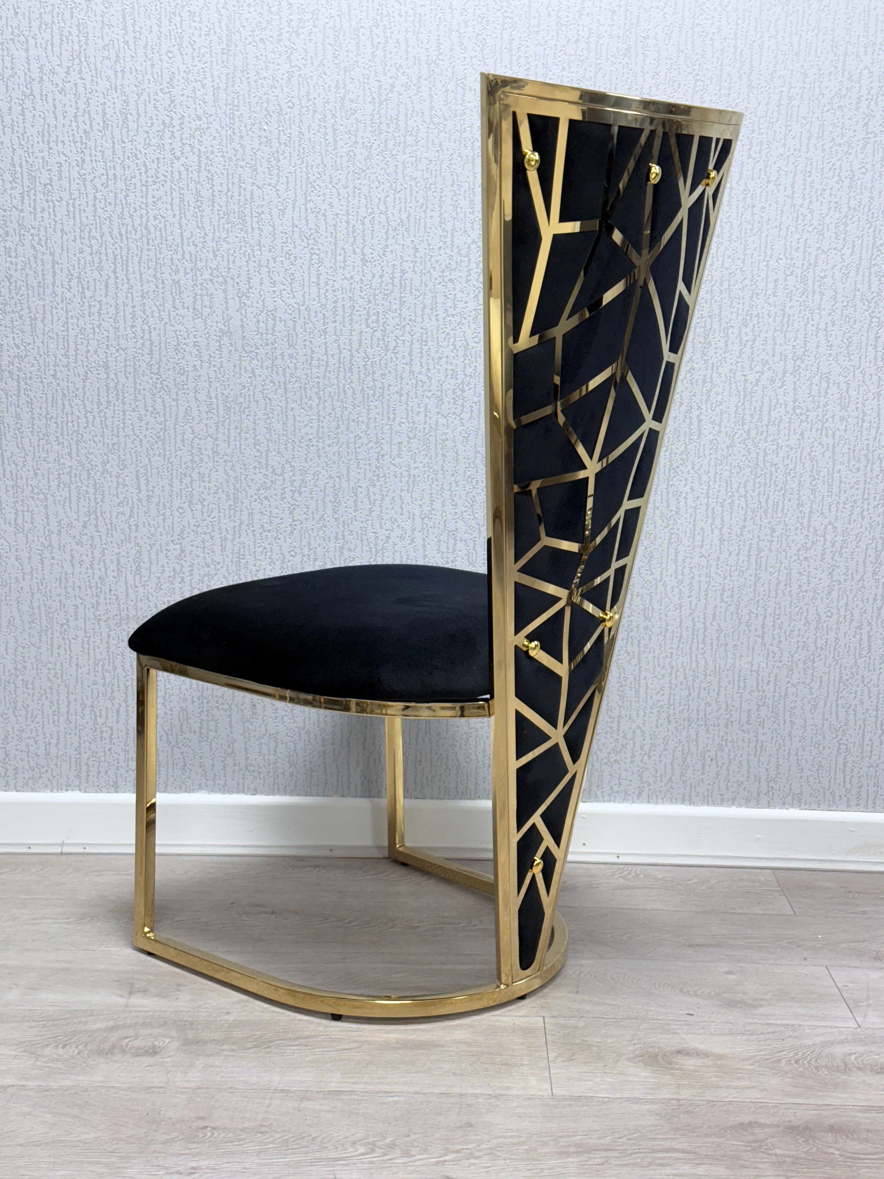 Designer Ariana 180cm dining table with Vienna chairs for Newcastle interiors, combining glossy marble, metallic gold accents and spacious seating for entertaining guests.
