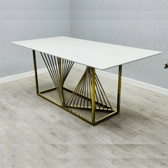 White ceramic dining table with gold metal frame