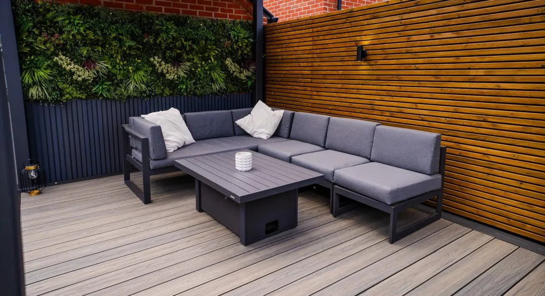 Dark brown composite decking installed in a garden