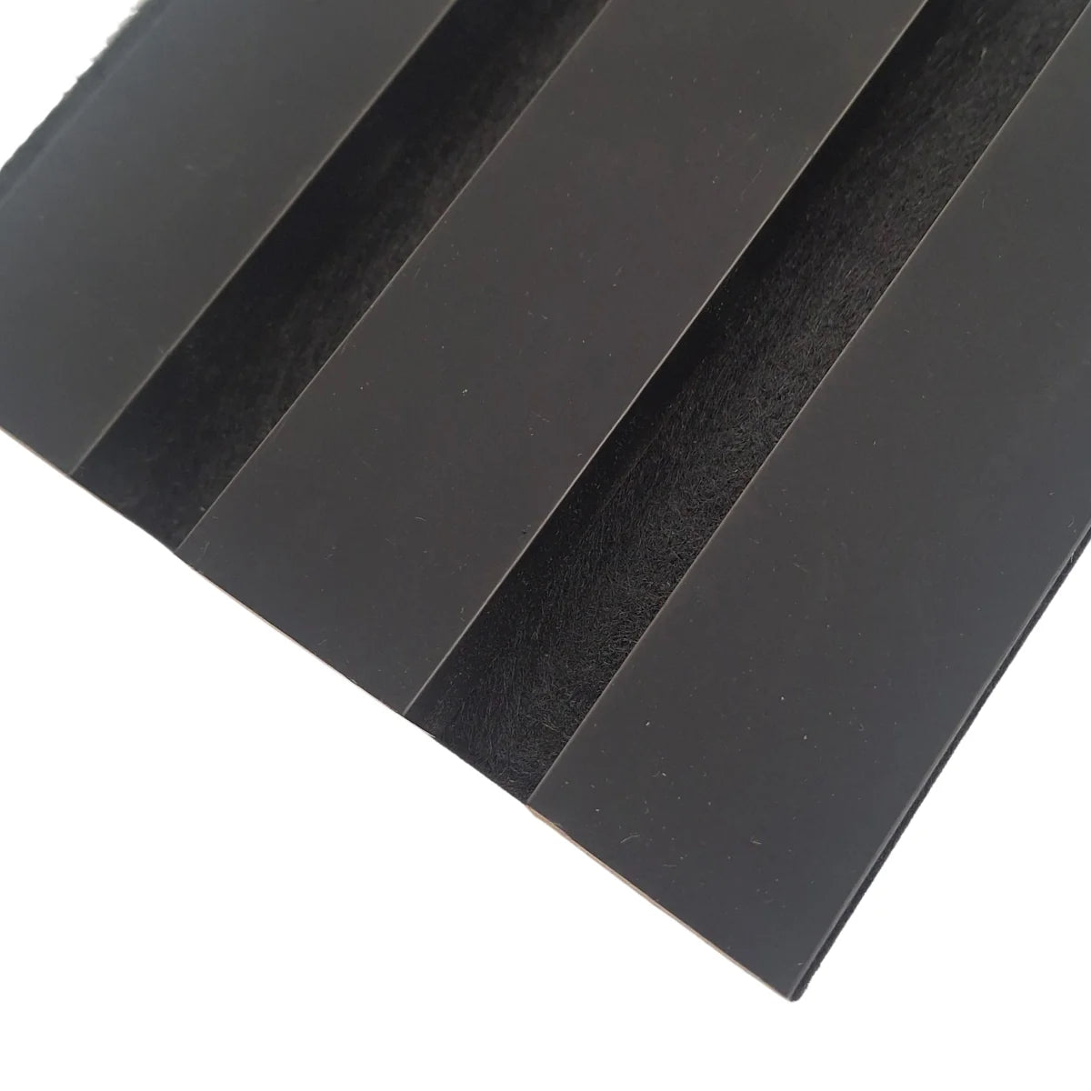 Close-up of finished coloured edges on a black 3-sided acoustic wall panel