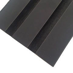 Close-up of finished coloured edges on a black 3-sided acoustic wall panel