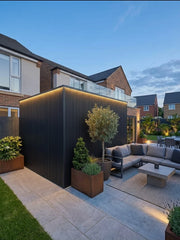 Black composite wall cladding used on a modern garden room exterior
