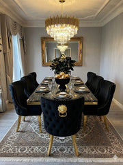 Black and gold marble dining set with luxurious Valentino Chairs, combining a high-gloss tabletop with refined metallic detailing for an elegant modern dining space.