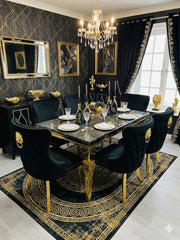 Elegant black and gold marble dining table with Valentino upholstered chairs creating a luxury dining room atmosphere in Surrey, Berkshire and Hertfordshire homes