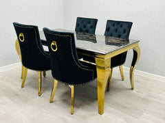 Designer black gold marble dining table with Majestic lion knocker chairs creating a glamorous dining room interior in Surrey, Essex and Hertfordshire UK homes