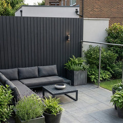 Black interlocking composite wall cladding panels for exterior walls