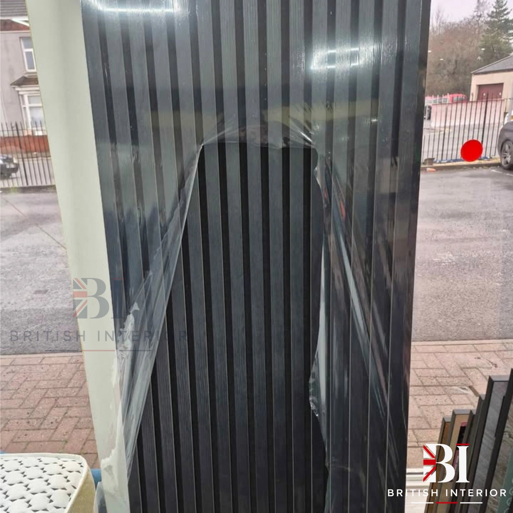 Black slatted acoustic wall panelling