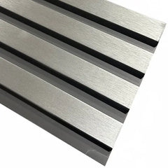 Close-up of chrome and black slatted WPC wall panel finish