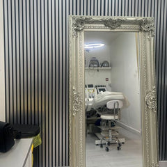 Chrome and black WPC slatted wall panels with wood-effect finish