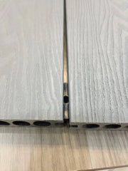 Composite decking fitting inserted into board groove