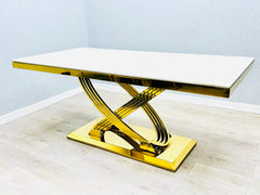 Contemporary cream marble dining suite with polished gold detailing, creating a refined focal point for luxury dining rooms.