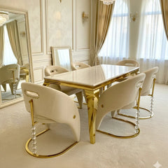 Elegant cream gold marble dining table with upholstered Vegas dining chairs creating a premium dining room interior in Surrey, Essex and Hertfordshire homes