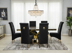 Cream and gold marble dining table paired with elegant Sofia gold chairs in a sophisticated modern dining room