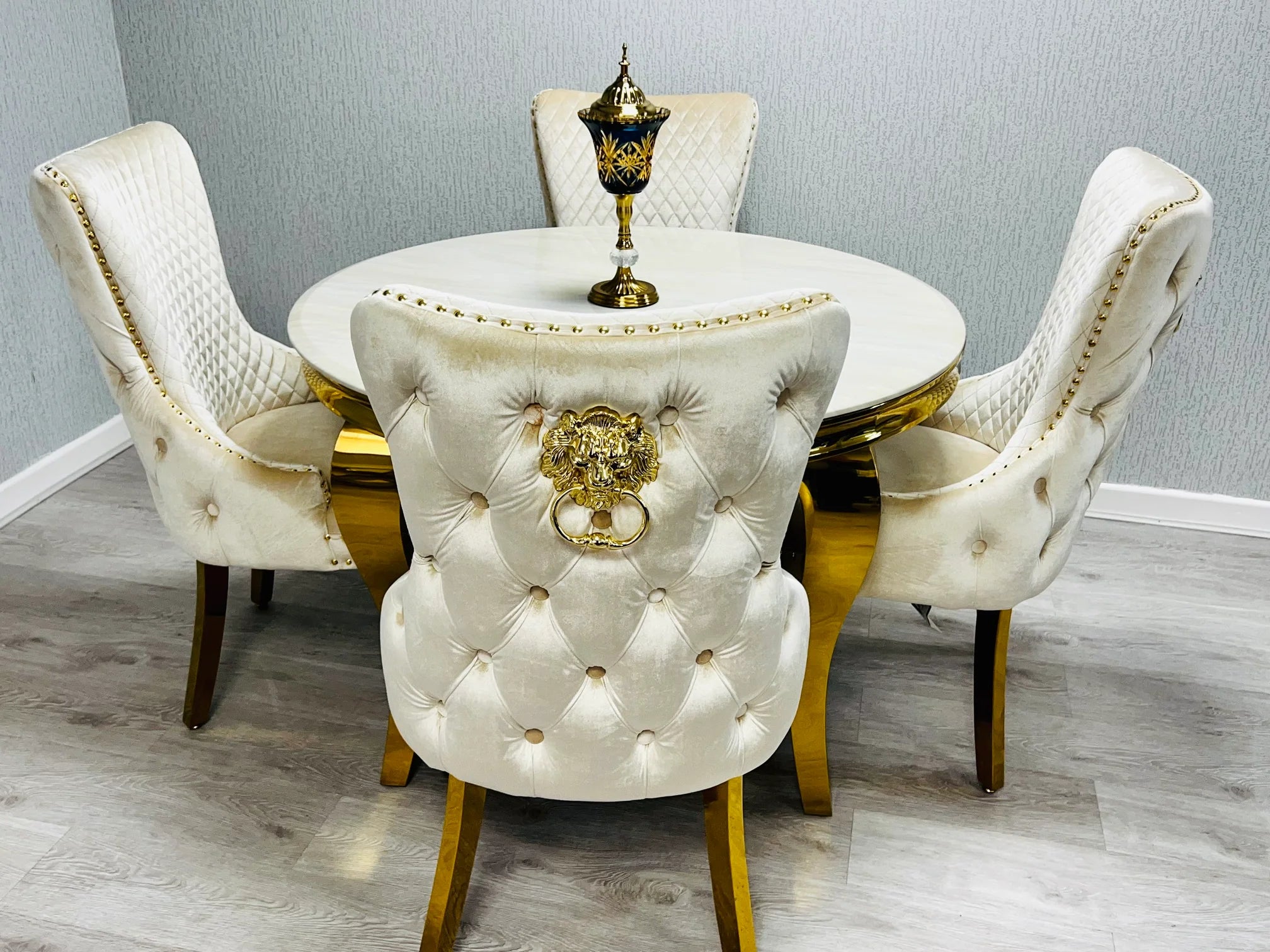 Bespoke cream gold marble dining table with Victoria lion knocker chairs for elegant dining rooms in Cobham, Sevenoaks and Beaconsfield UK