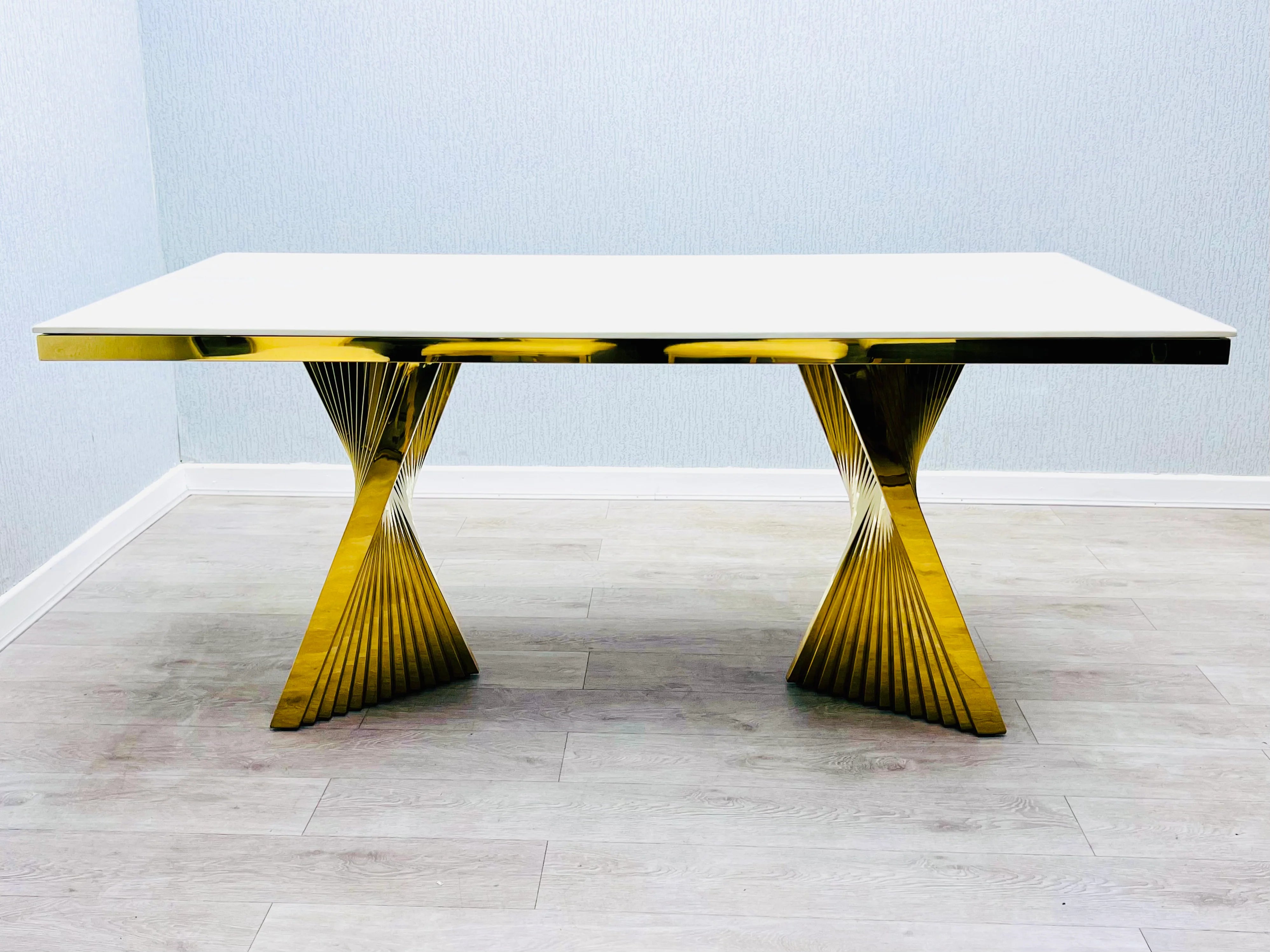 Elegant cream marble dining set with polished gold base and upholstered lion knocker chairs for Glasgow interiors