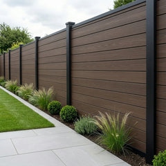 Dark brown composite fence panels installed in a modern garden