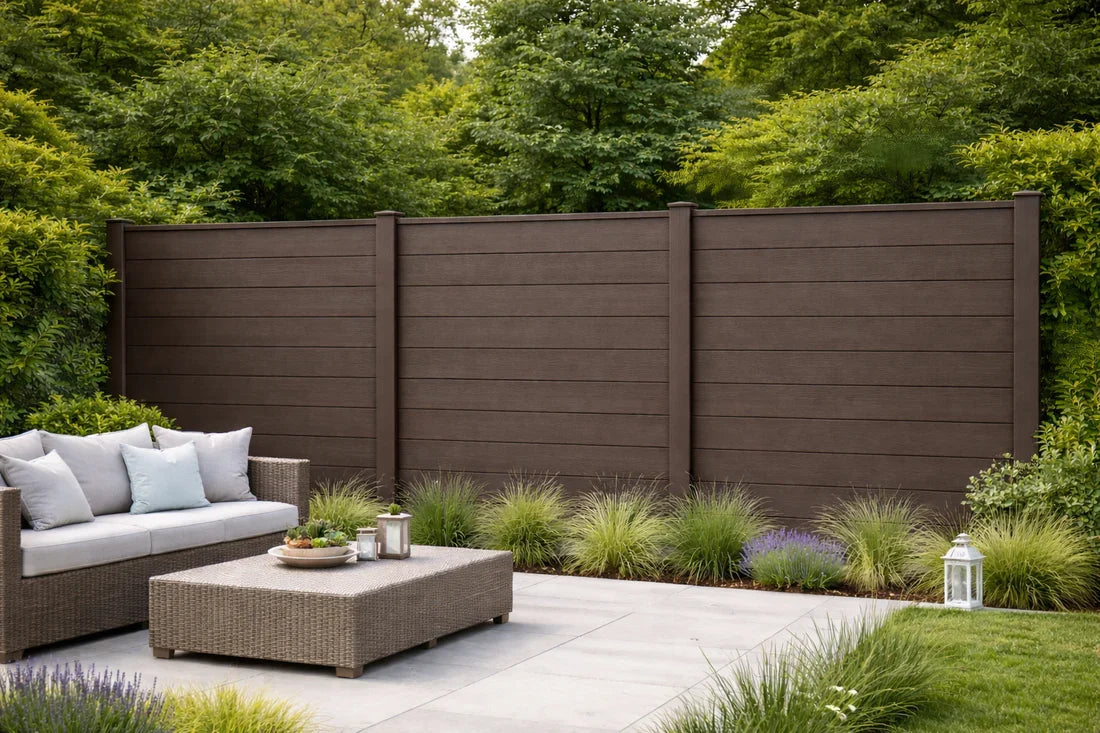 Dark brown composite fence panels installed in a modern garden
