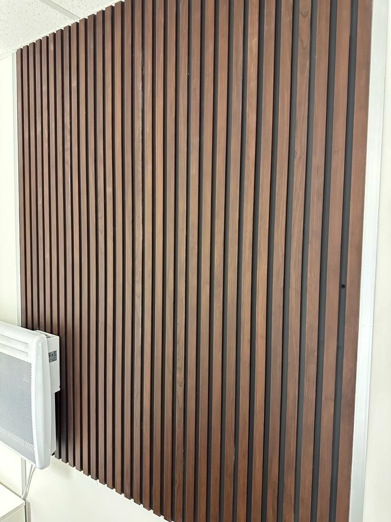 Dark Oak slatted wall cladding used on a modern interior wall