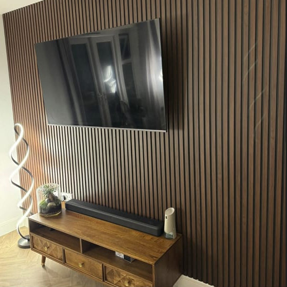 Dark Oak WPC slatted wall cladding in a home office