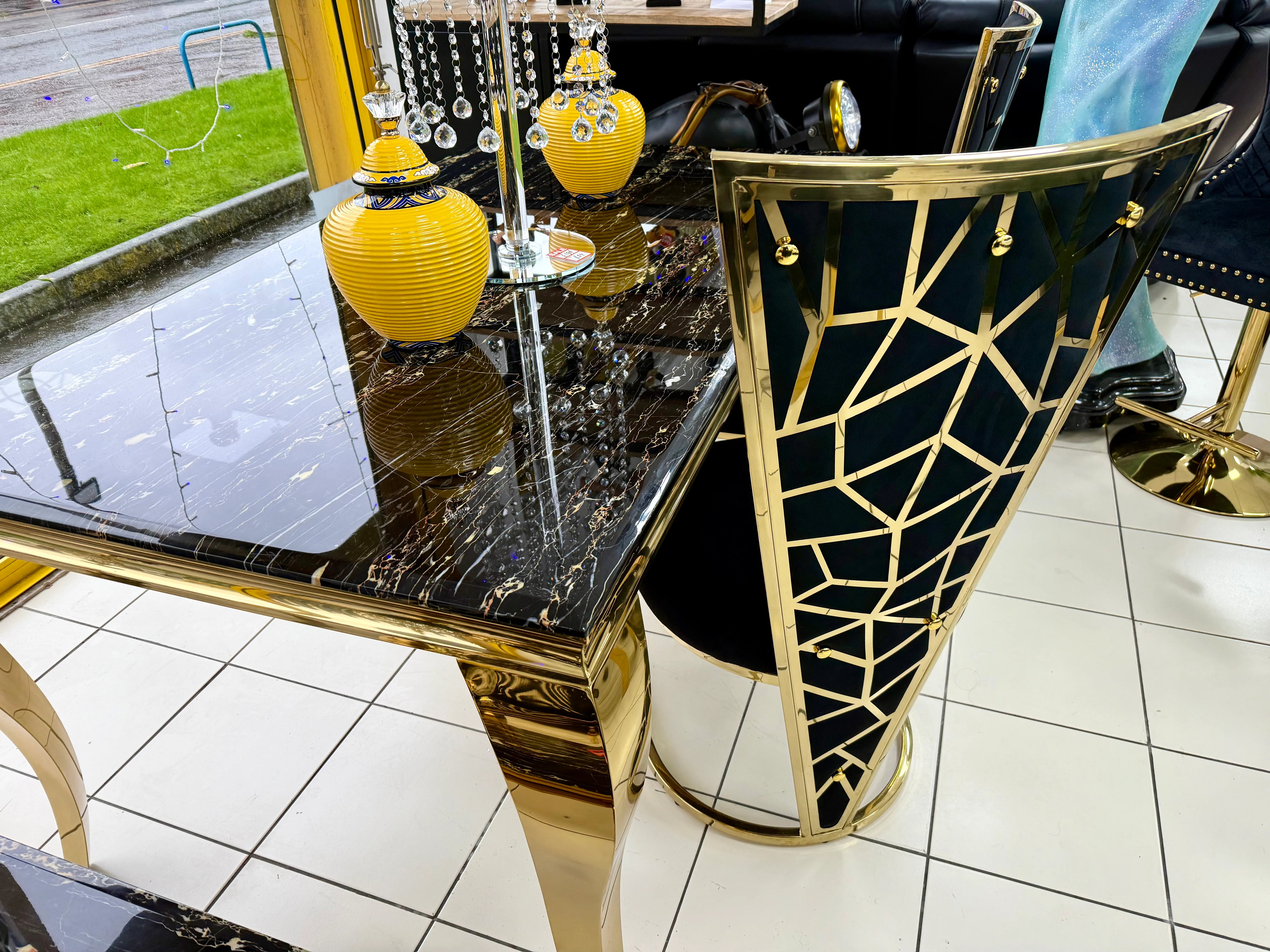 Designer black gold marble dining room set with upholstered Vienna chairs for elegant interiors in Oxford, Cambridge and Bath UK properties