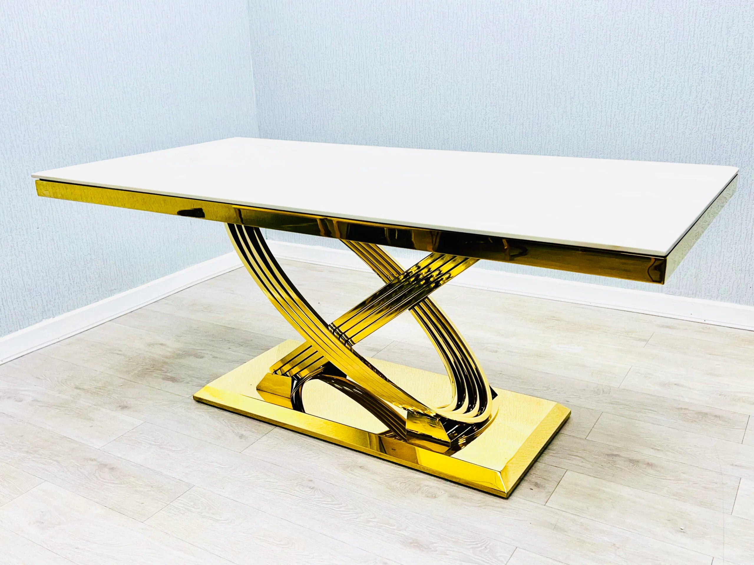 Elina 180cm cream marble dining table with high-gloss polished surface and geometric gold pedestal base