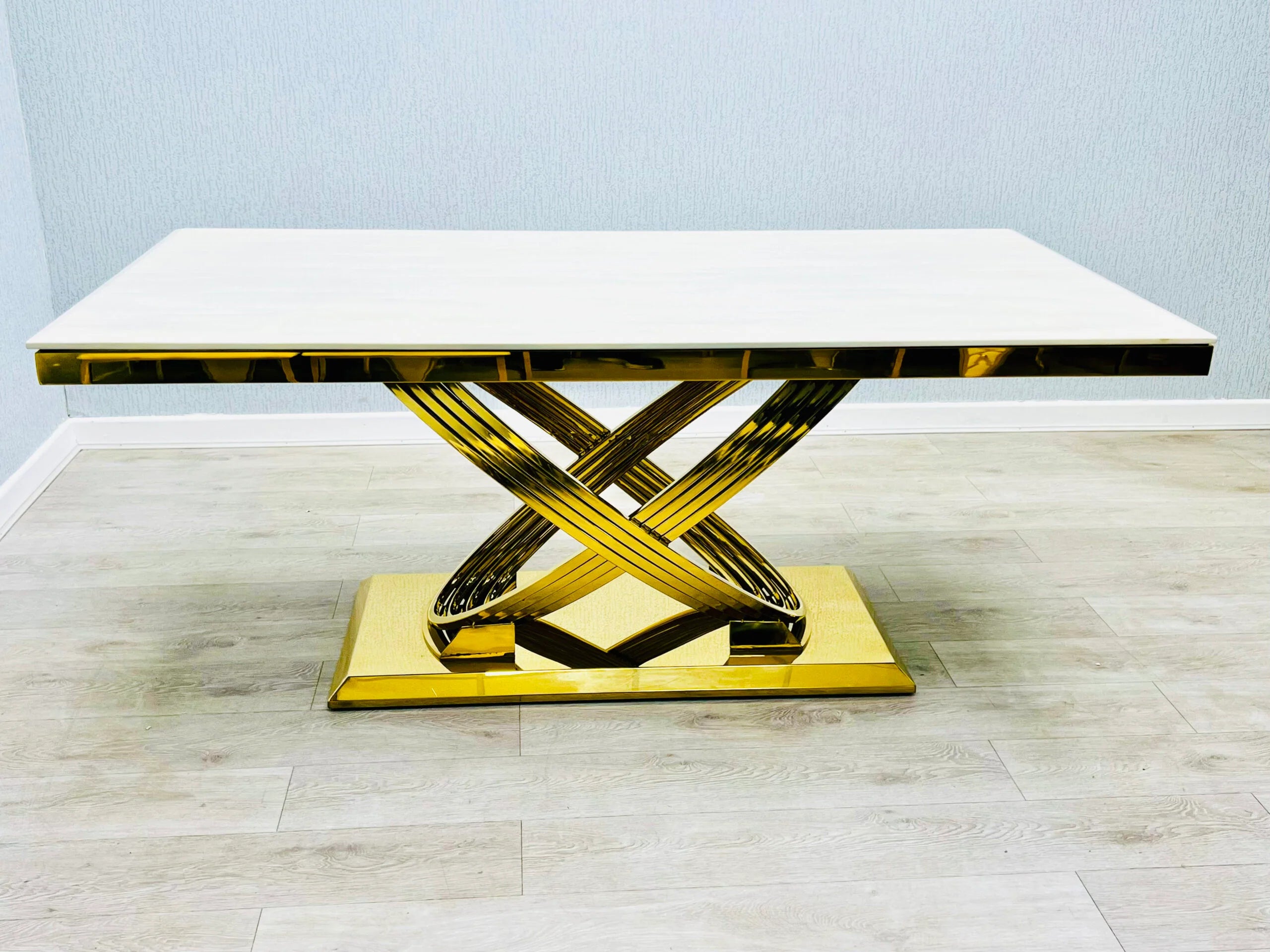High-gloss cream marble tabletop on the Elina dining table creating an elegant premium dining surface