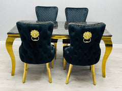 black and gold marble dining table with statement Victoria chairs for an upscale Bournemouth dining interior