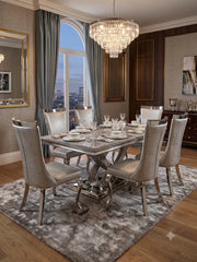 Elina grey marble dining table with matching grey upholstered chairs in a sophisticated dining interior