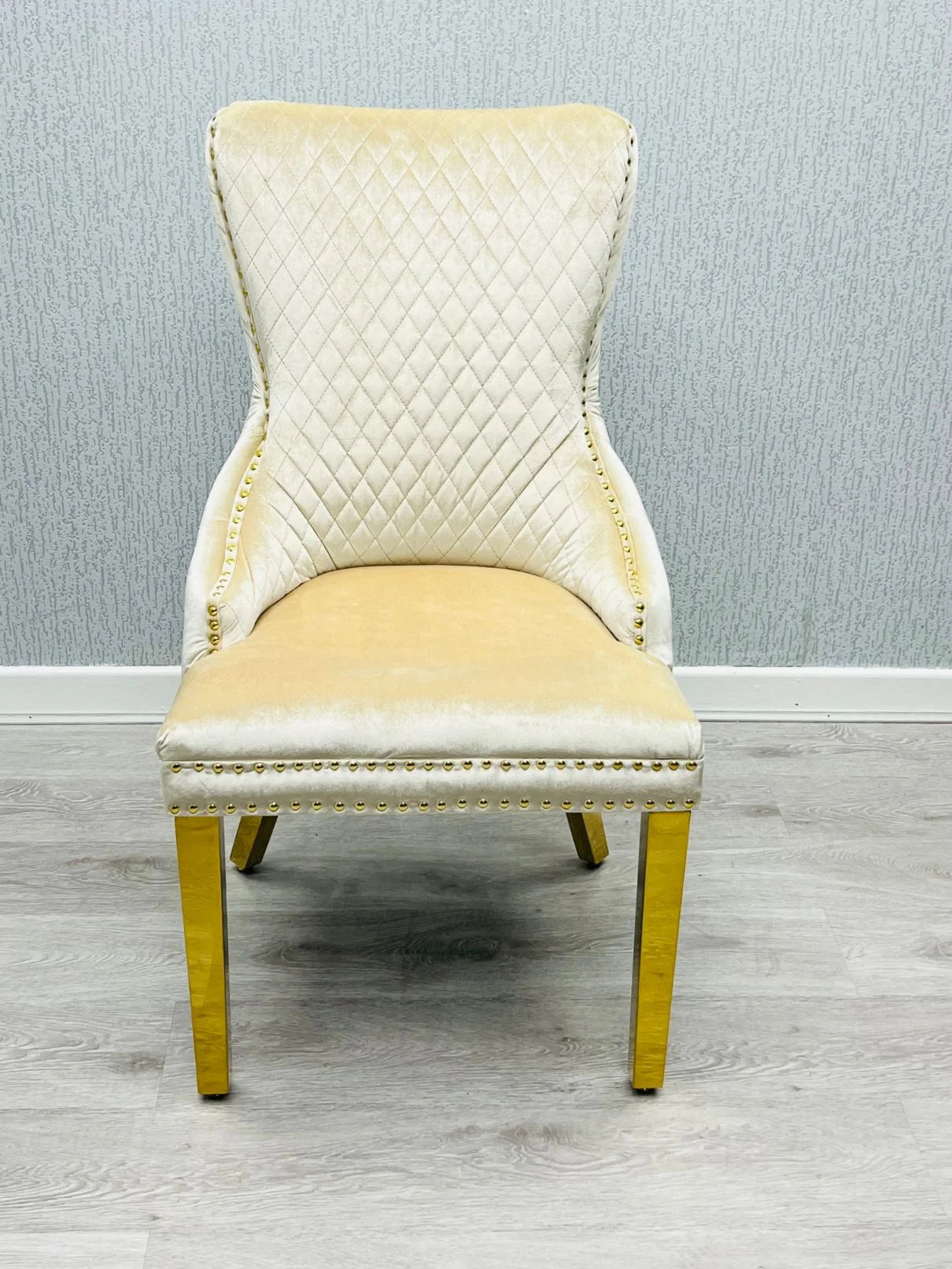 Premium 6 to 8 seater marble dining furniture featuring a gold pedestal table and upholstered lion knocker chairs