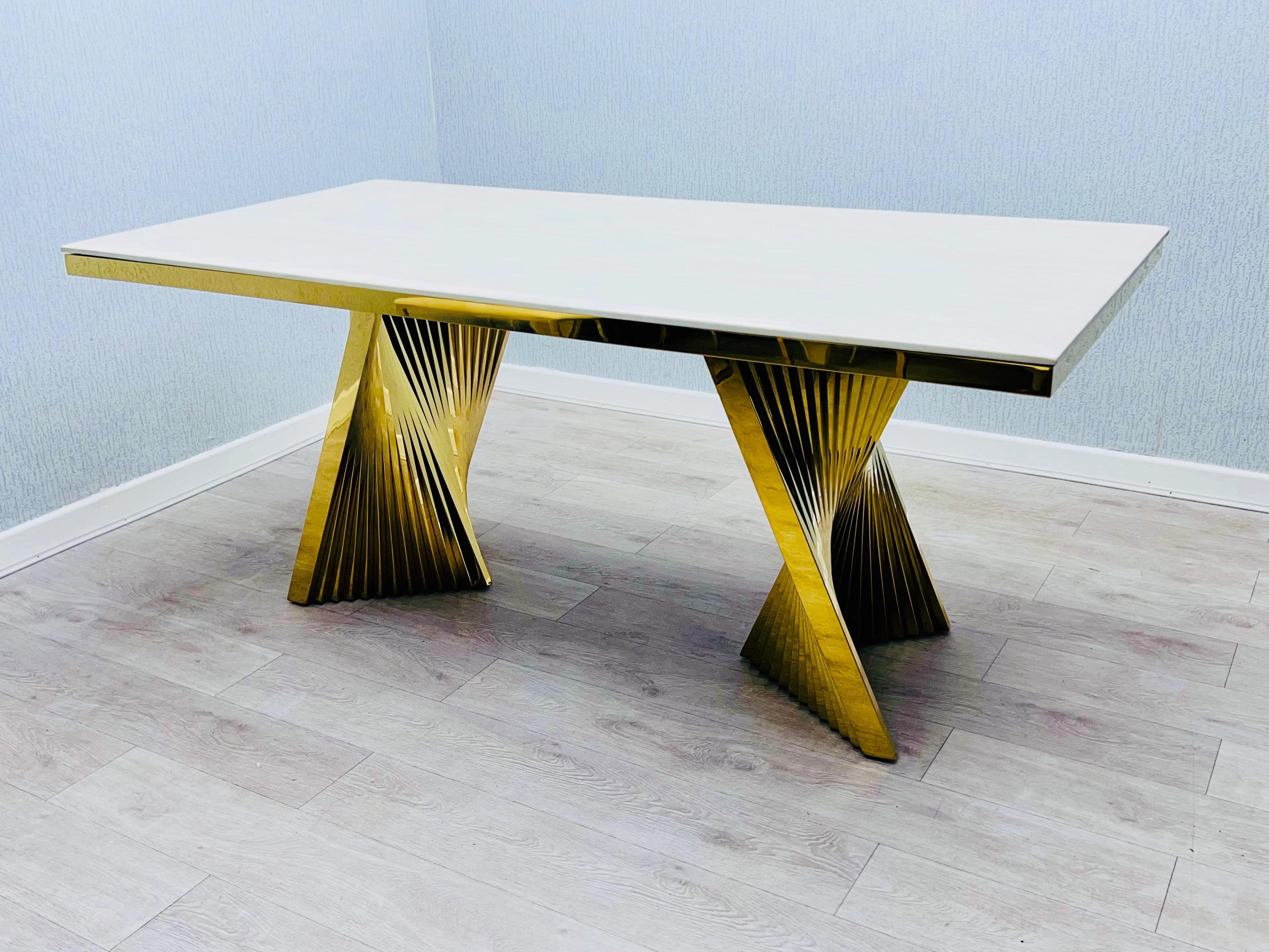 Gold pedestal marble dining set with Porado dining chairs for a contemporary dining room