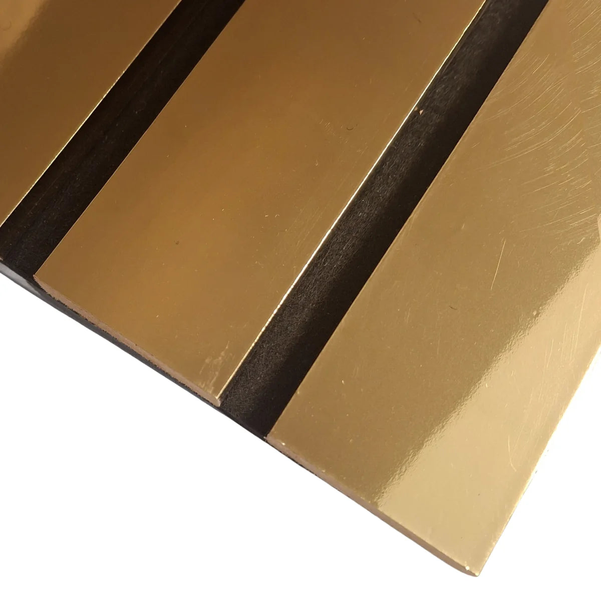 Close-up of gold WIDE slats showing the textured finish and detailed surface