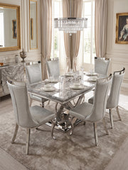 Grey marble dining table with stylish grey dining chairs creating an elegant modern dining set