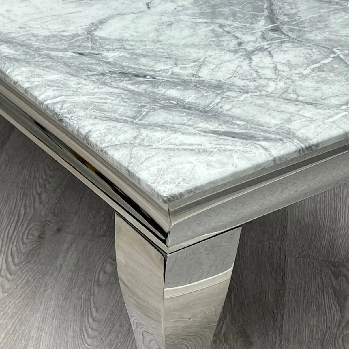 Grey marble dining table with a durable base designed for long-lasting everyday use.