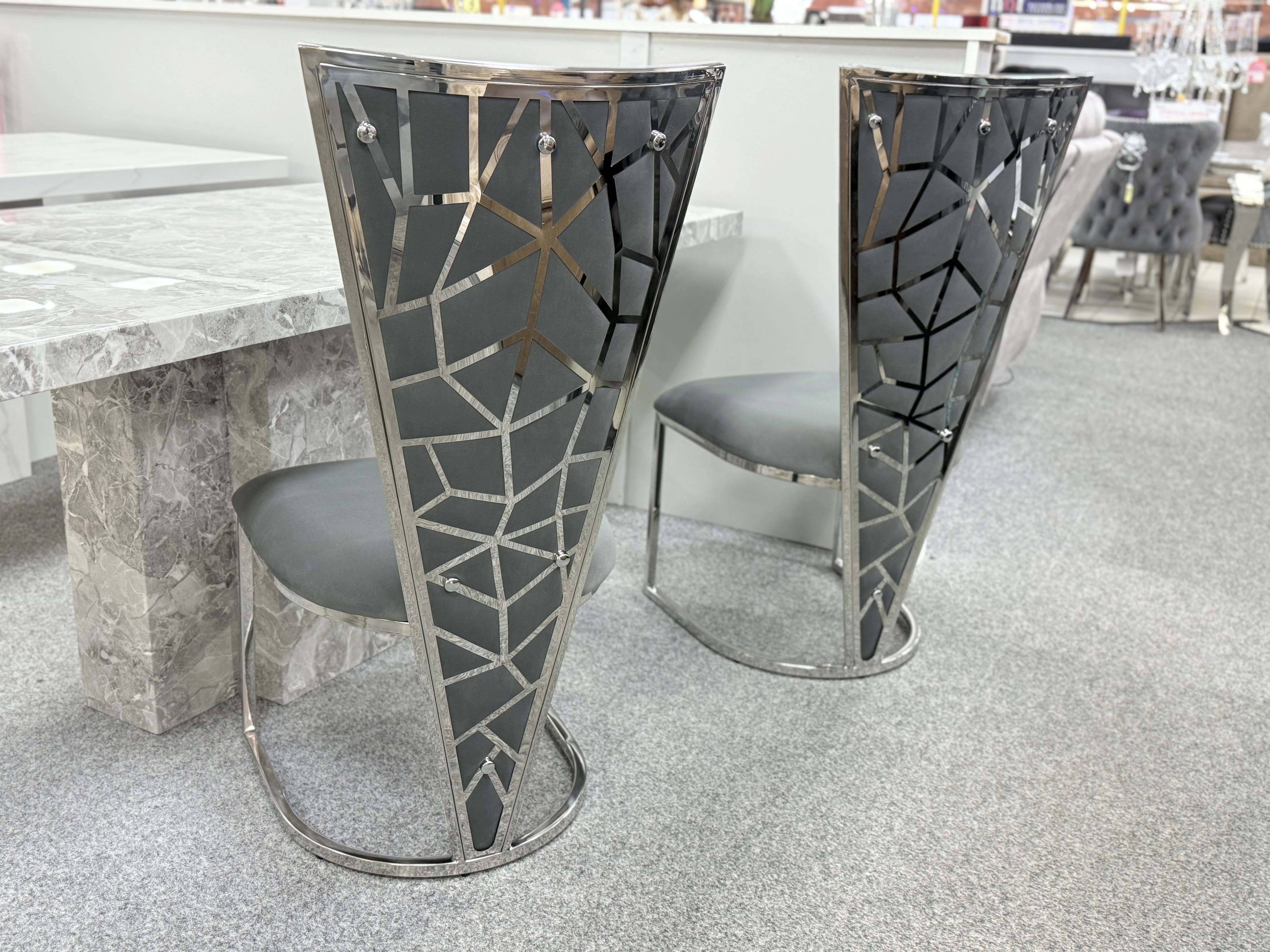 Elegant marble dining table with Vienna seating crafted for Southampton homes, creating a refined atmosphere for family dining and entertaining.