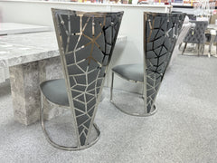 Elegant marble dining table with Vienna seating crafted for Southampton homes, creating a refined atmosphere for family dining and entertaining.