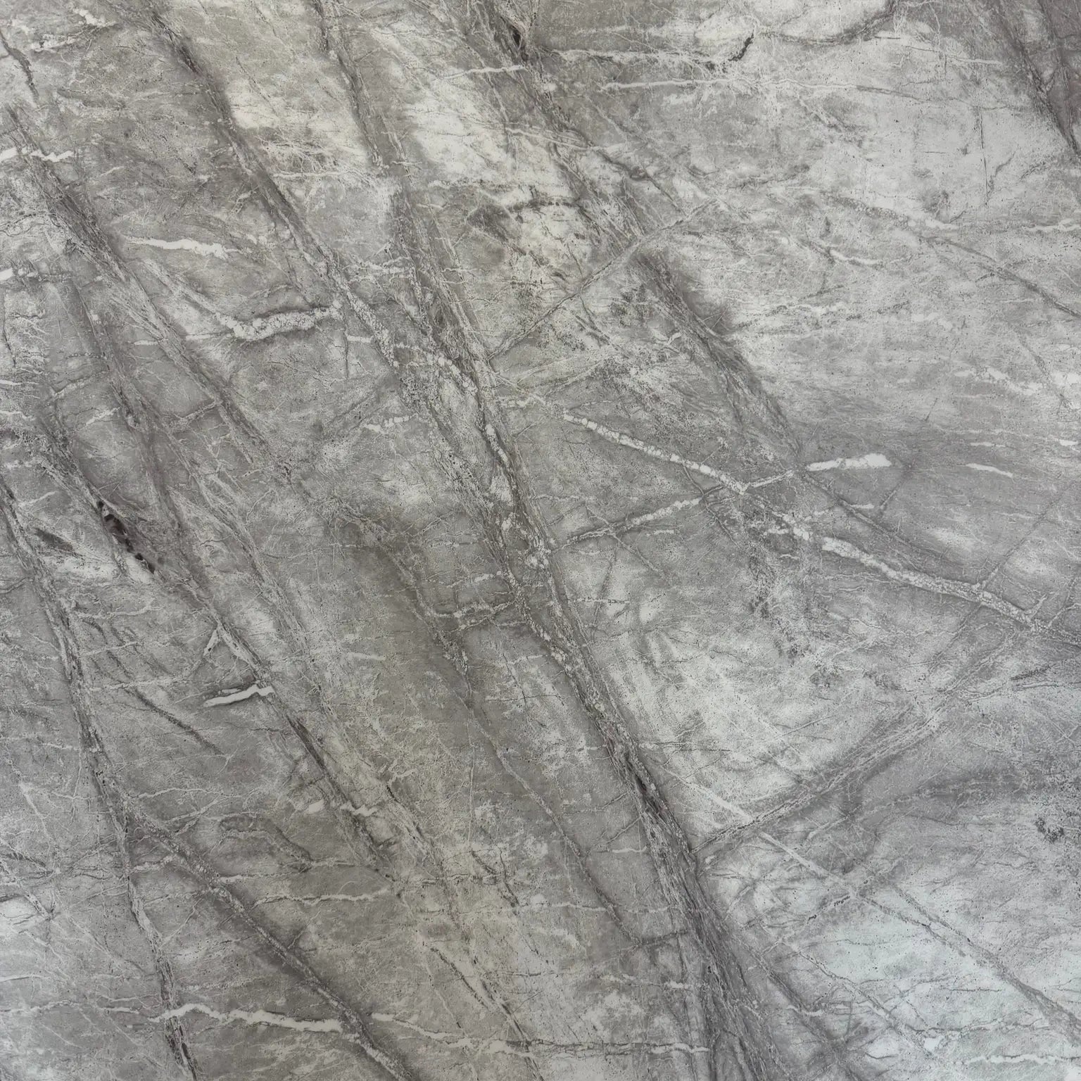 Close-up of the premium grey marble tabletop with a smooth polished finish.