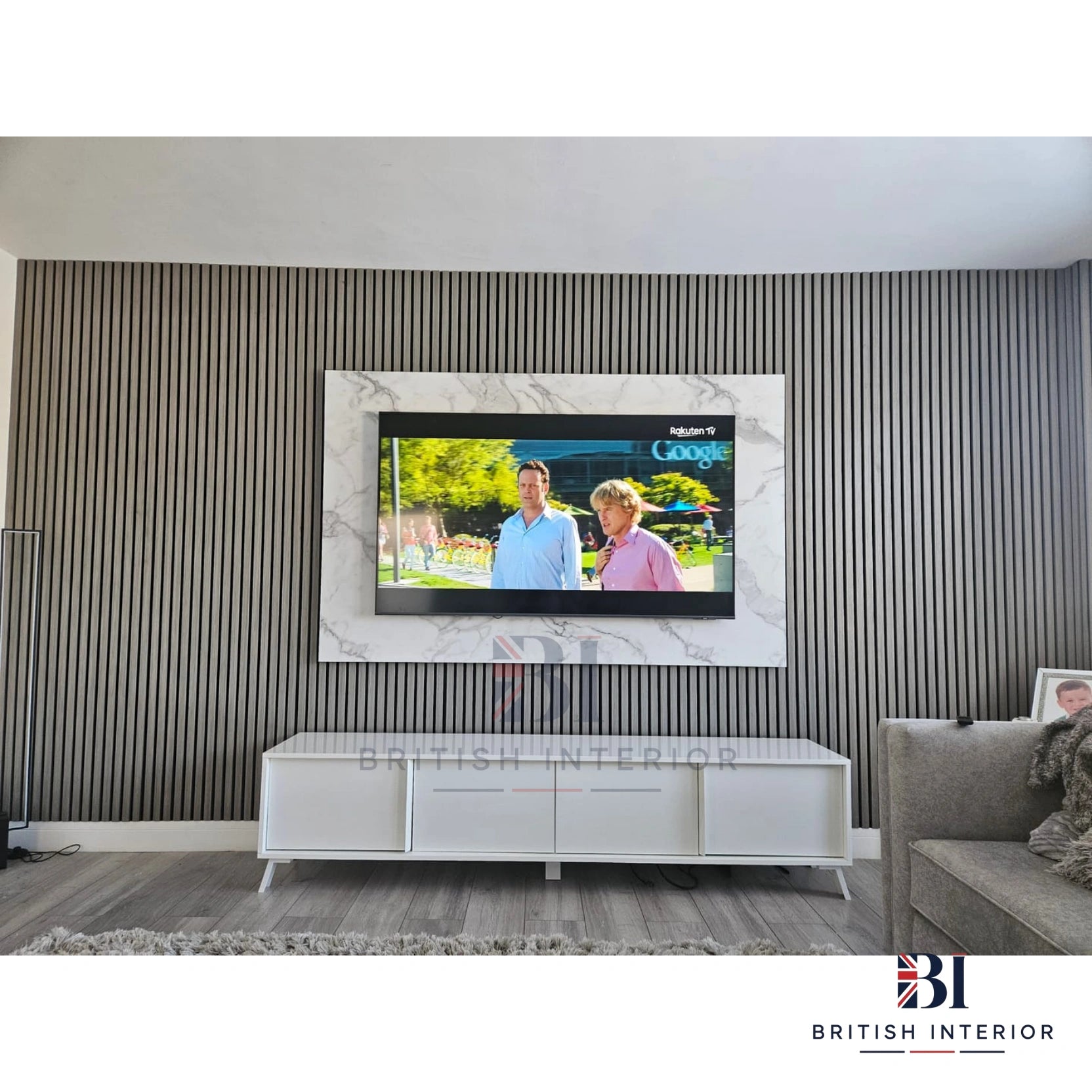 Grey oak vertical slat panelling creating a stylish TV media wall